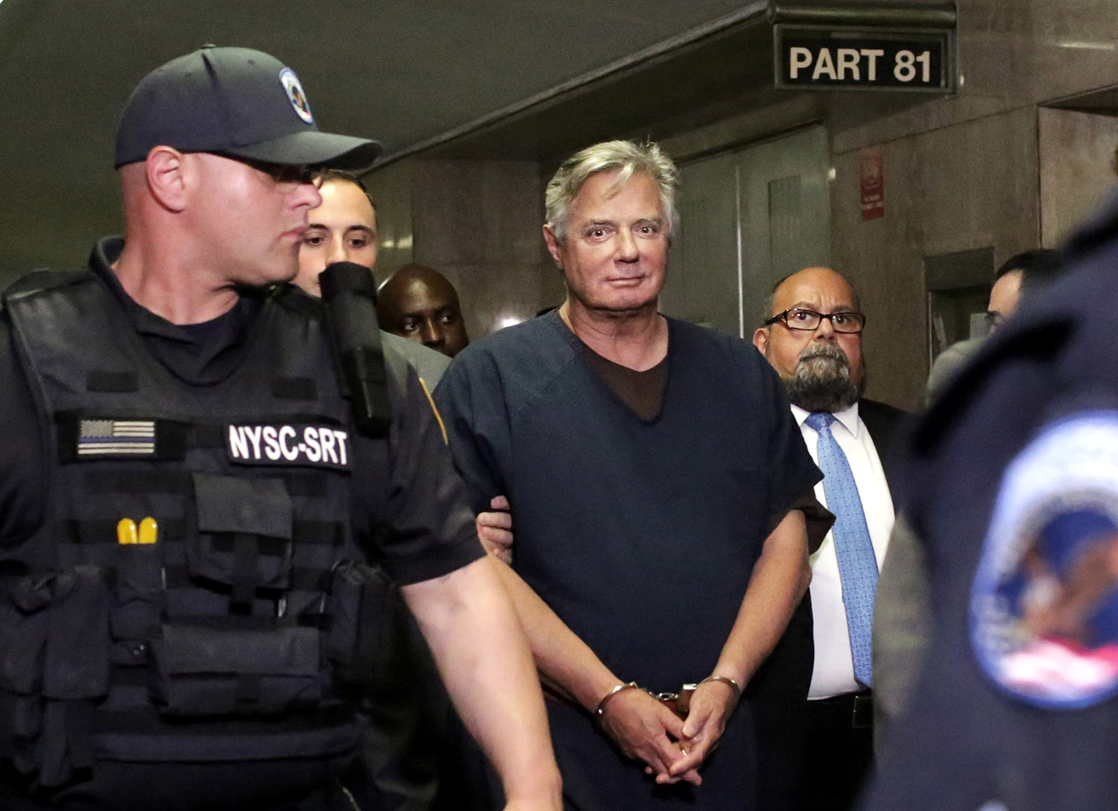 Former Trump campaign chairman Paul Manafort leaving his arraignment on multiple felony charges in Manhattan Criminal Court, New York, June 27, 2019