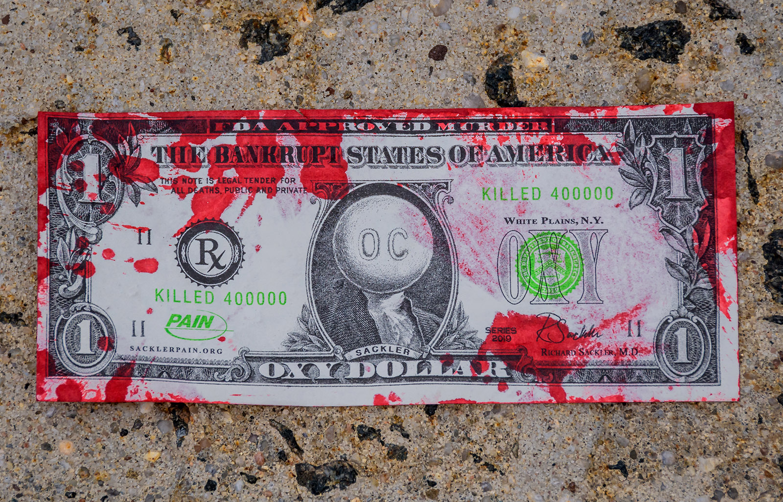 One of the “Oxy Dollars” thrown outside a courthouse where Purdue Pharmaceuticals bankruptcy hearing was being held, White Plains, New York, October 10, 2019