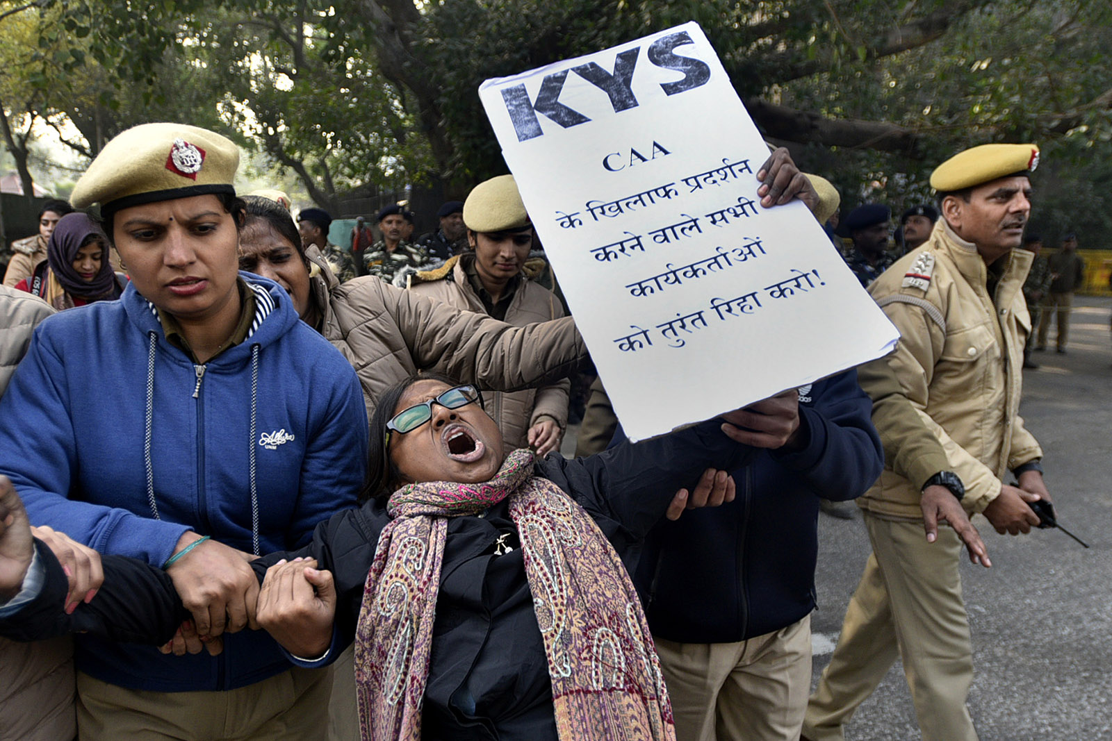A protester against the Citizenship (Amendment) Act being detained outside a government office for the state of Assam, New Delhi, India, December 23, 2019