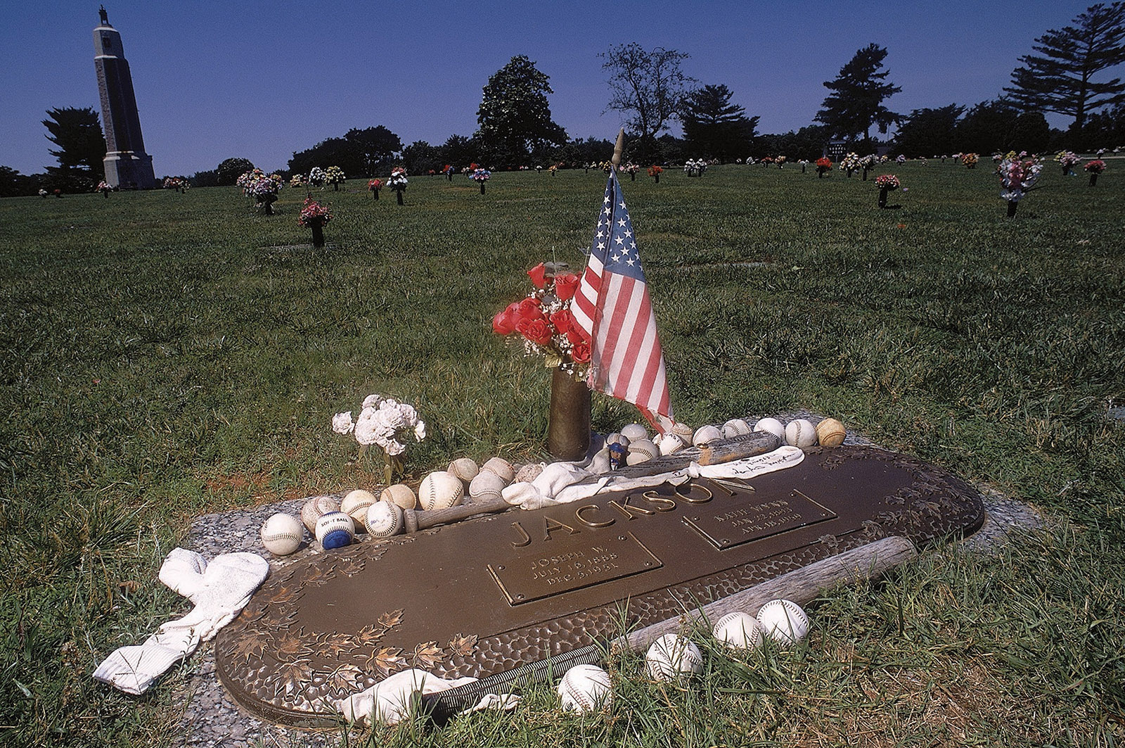 Fans’ mementos adorning the grave of Chicago White Sox player “Shoeless” Joe Jackson at Woodlawn Memorial Park, Greenville, South Carolina, 2003