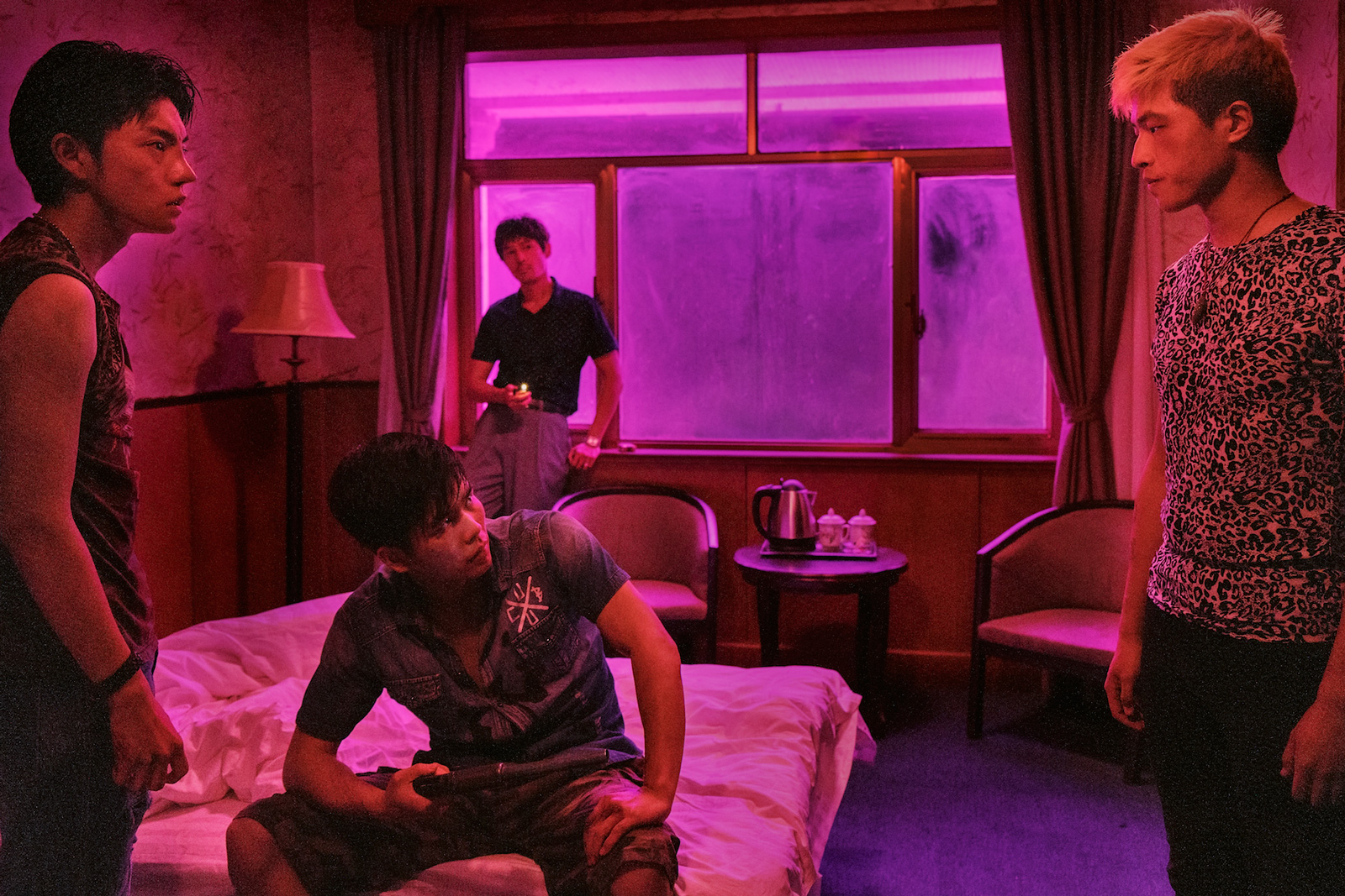 Ge Hu as Zenong Zhou, back left, in Diao Yinan's The Wild Goose Lake, 2020