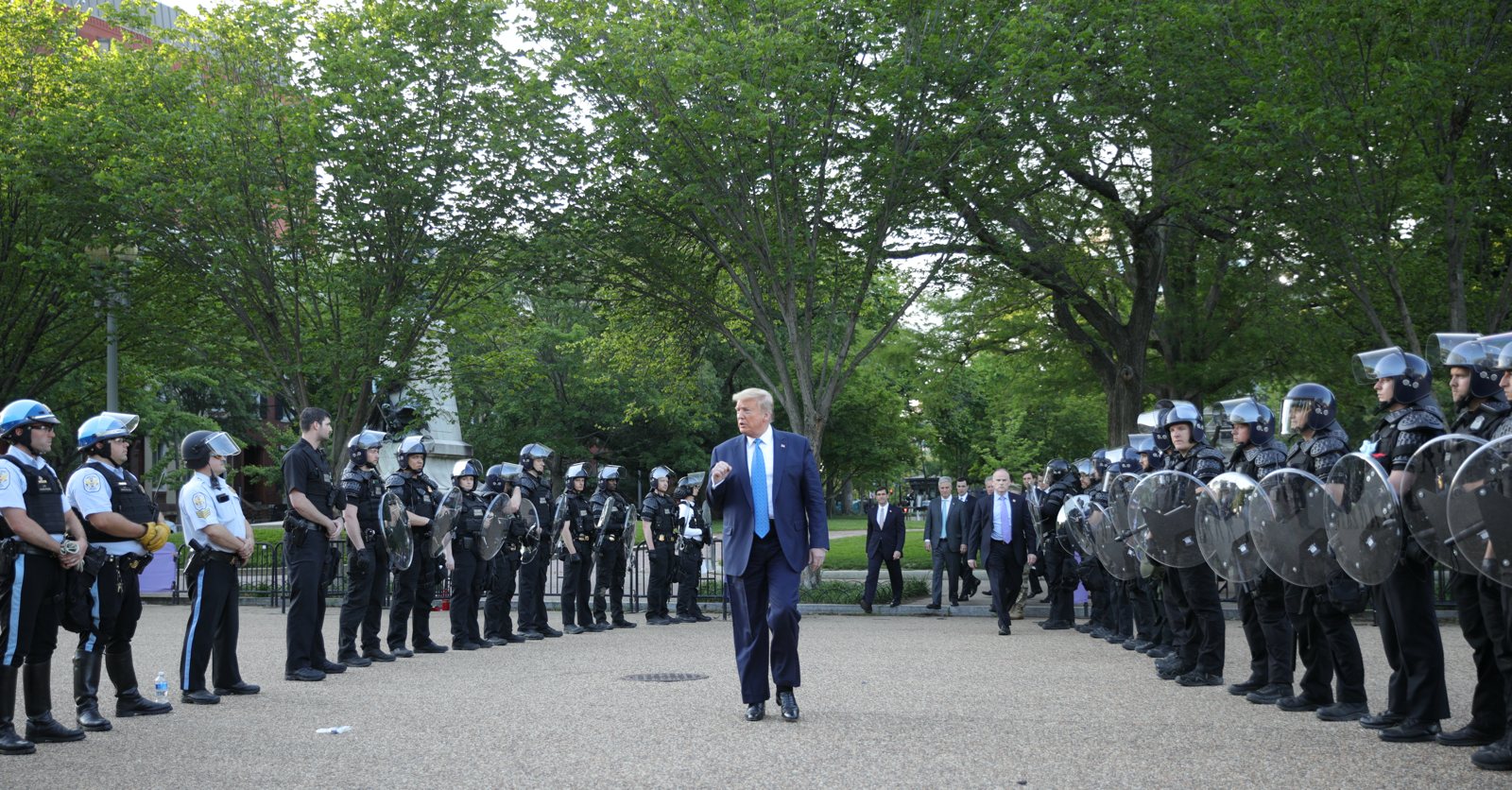 Donald Trump walking past riot police in Lafayette Park during protests following the police killing of George Floyd, Washington, D.C., June 2020