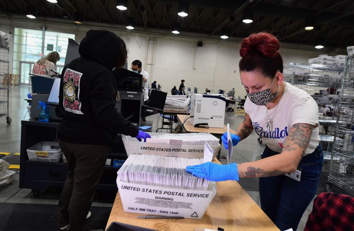 Election workers preparing mail-in ballots