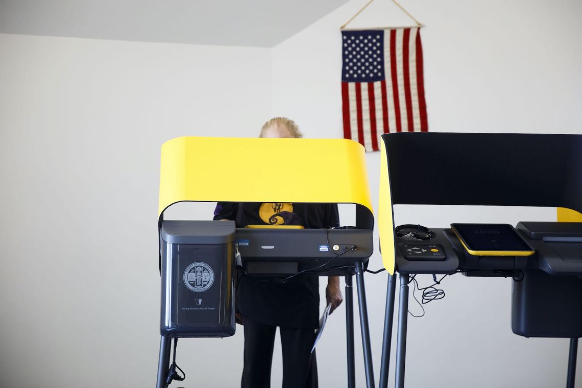 A voter casting a ballot on an electronic device