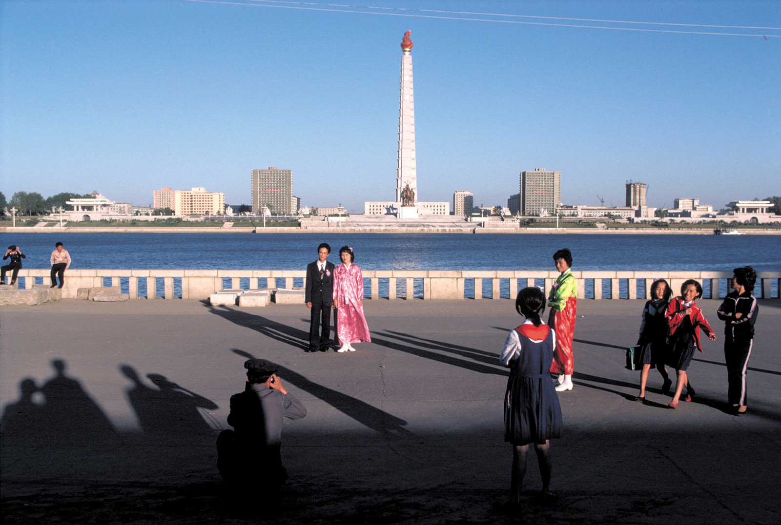 A newlywed couple on the banks of the Taedong River, Pyongyang, North Korea