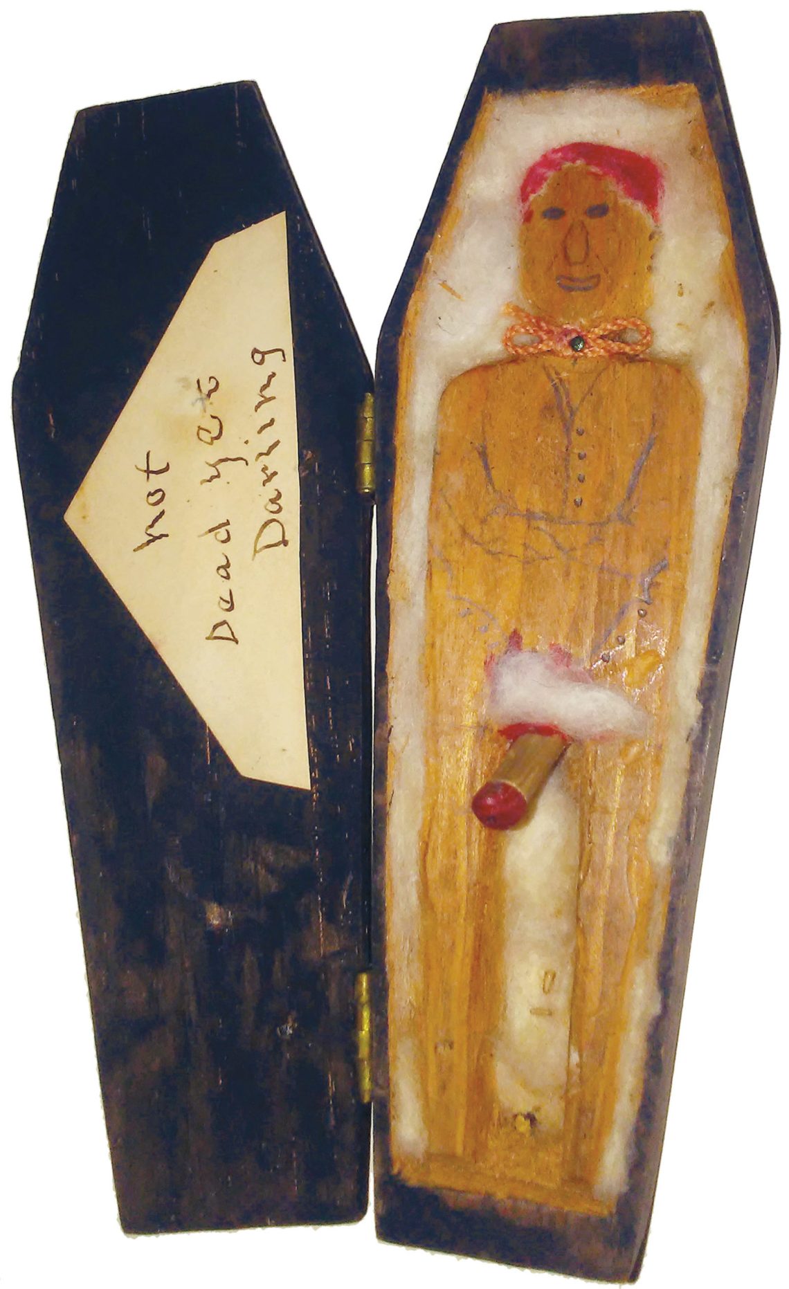 A toy coffin with the inscription Not Dead Yet Darling, circa 1930