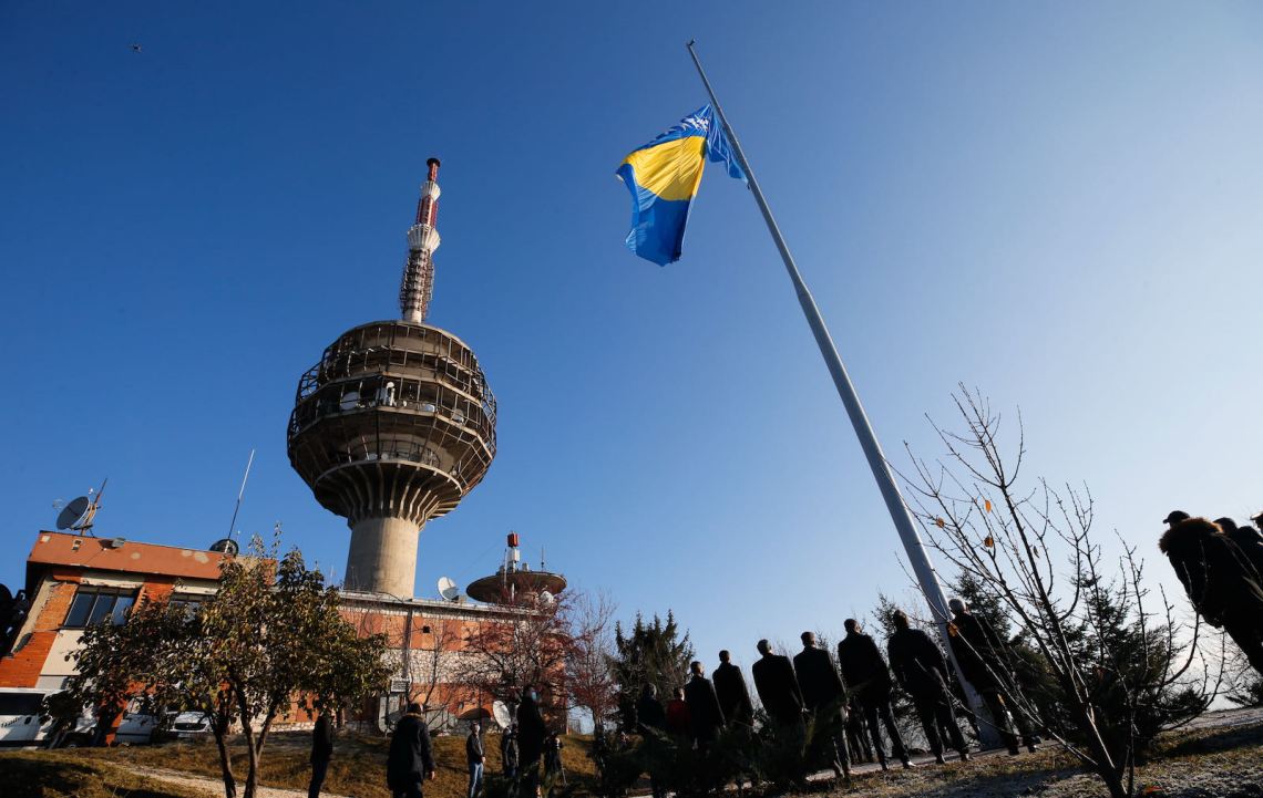 A Bosnian flag being raised