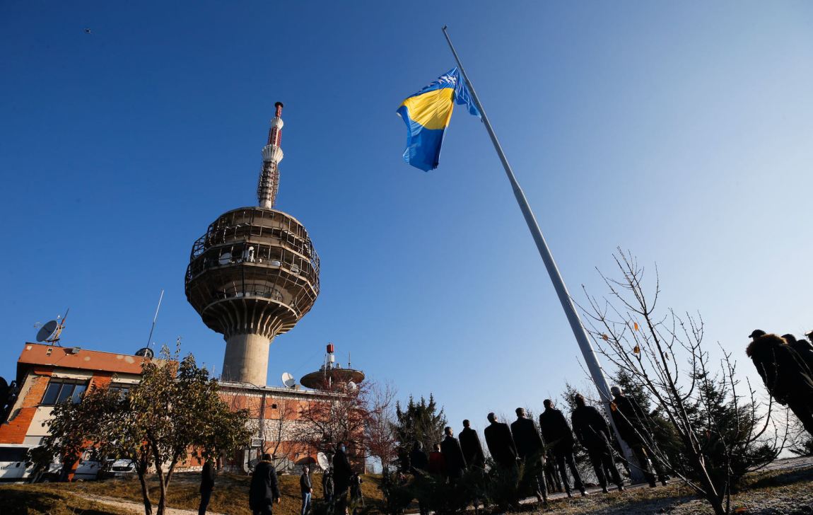 A Bosnian flag being raised