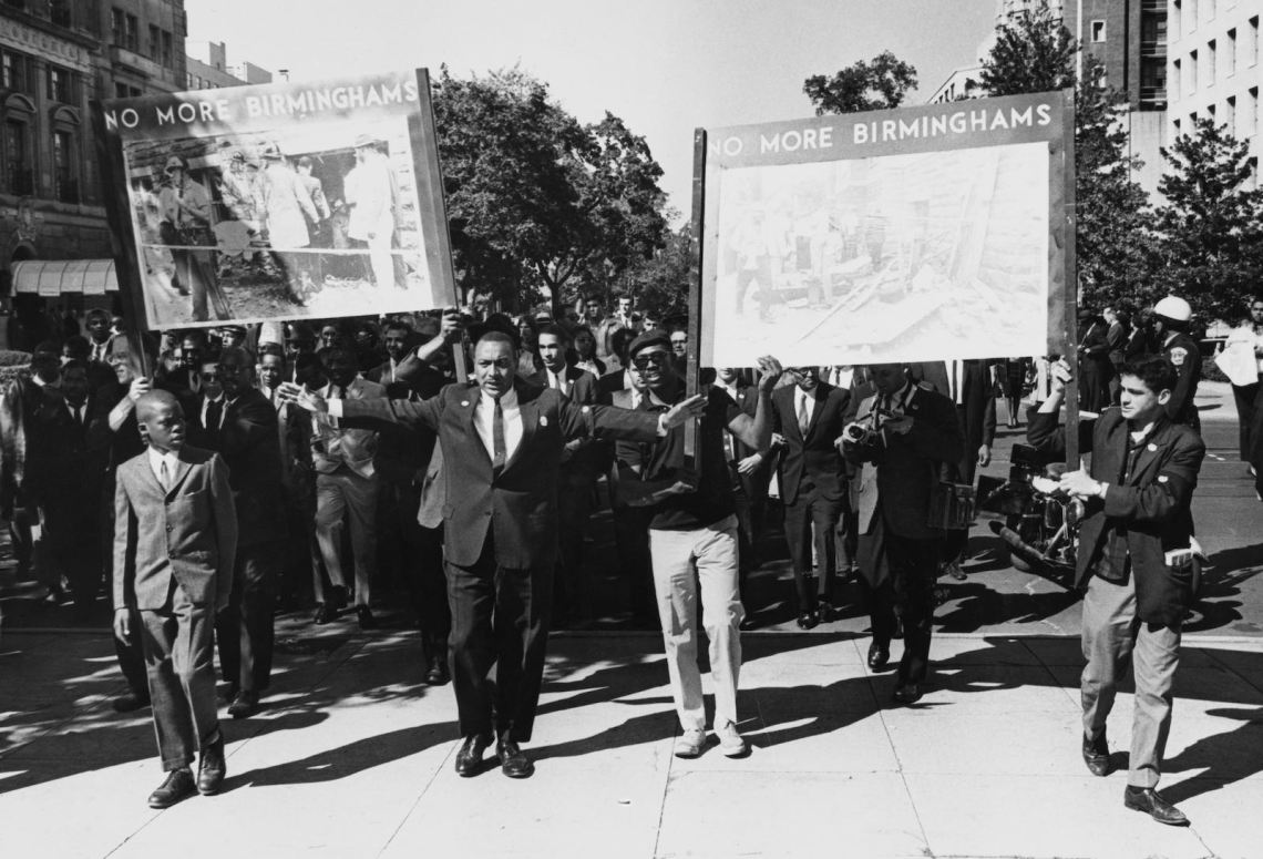 Civil rights demonstrators holding placards, 1963