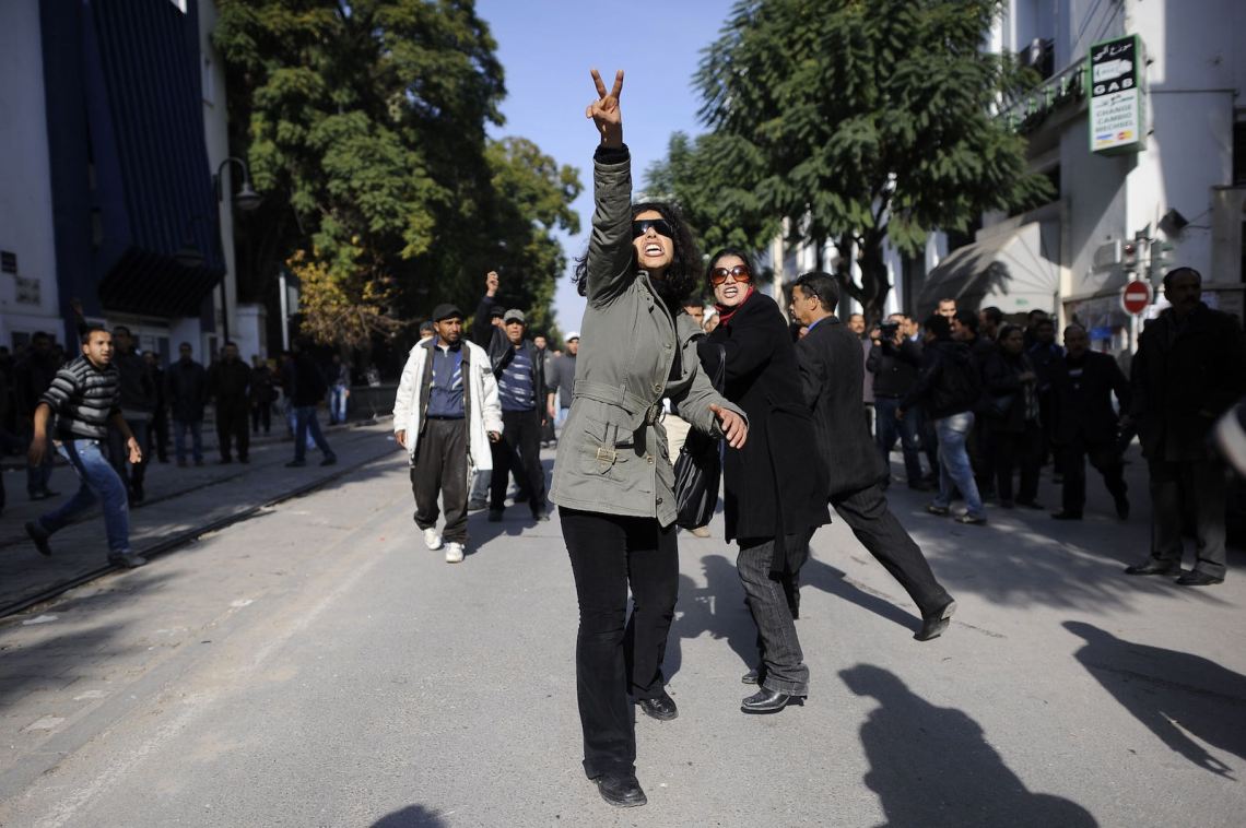 A Tunisian demonstrator gesturing