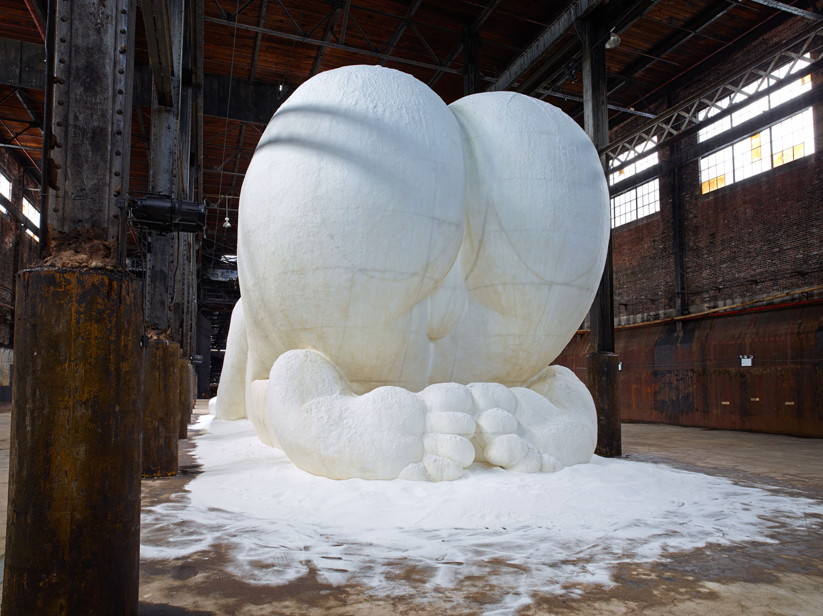 Kara Walker's sculpture of a mammy figure made from sugar, shown from behind
