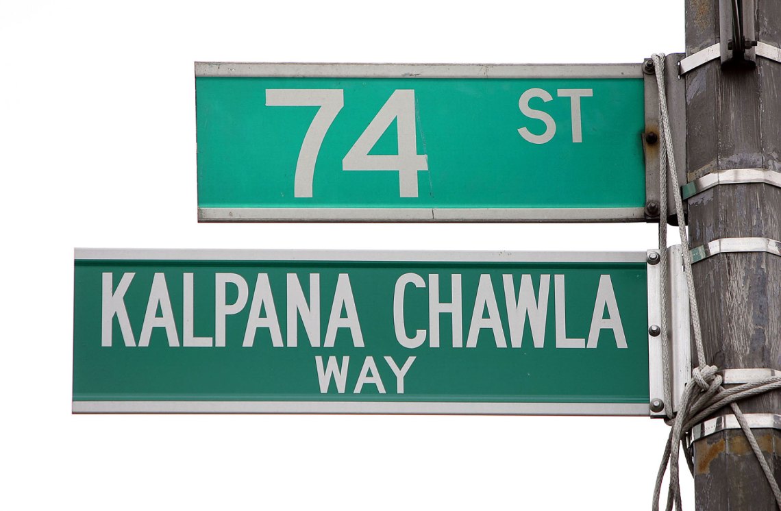 Street signs reading 74th Street and Kalpana Chawla Way