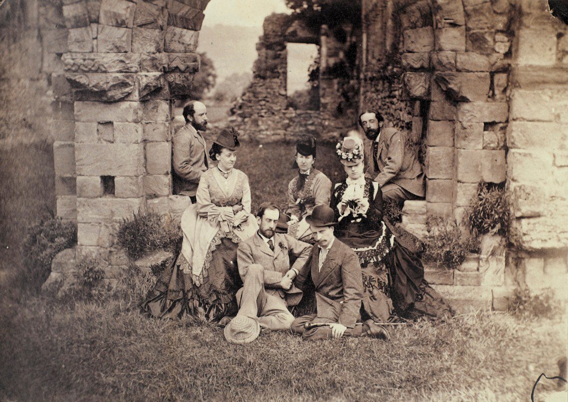 Henry Adams at Wenlock Abbey, England. The woman at the right may be his wife, Marian (Clover) Adams