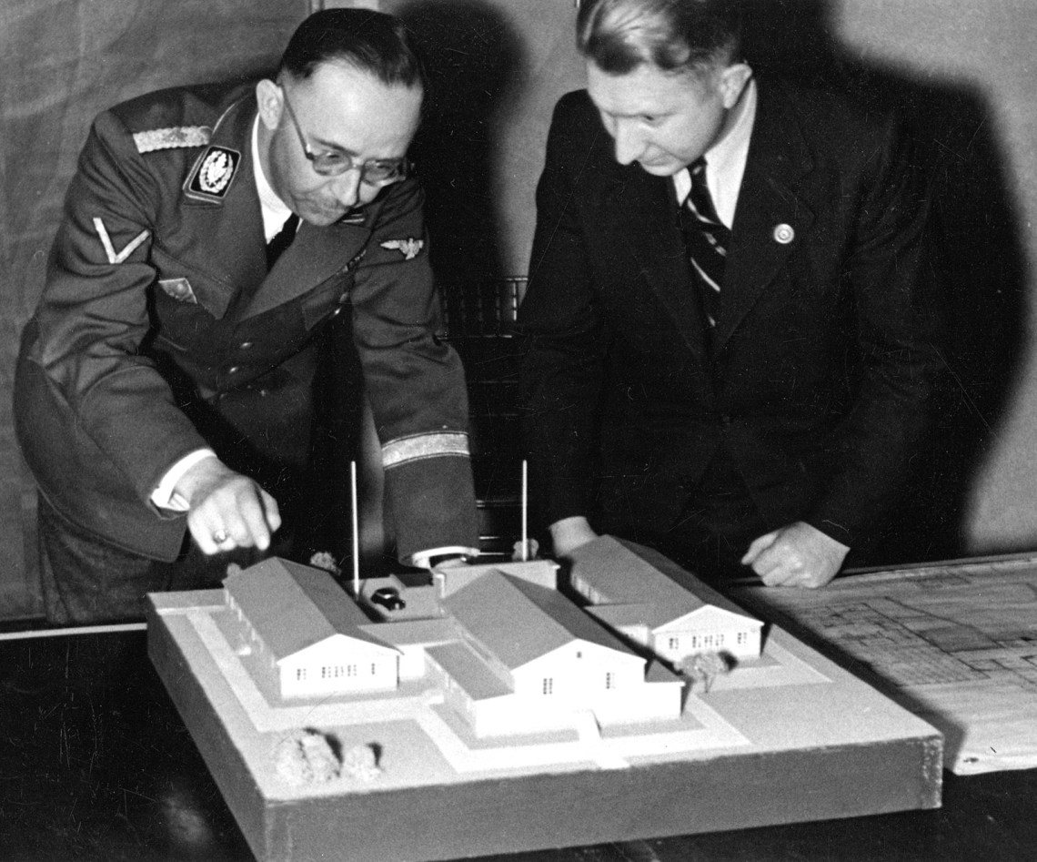 Heinrich Himmler looking at a model with Edgar Haller, who oversaw the design of soldiers’ housing during the Nazi occupation of Norway