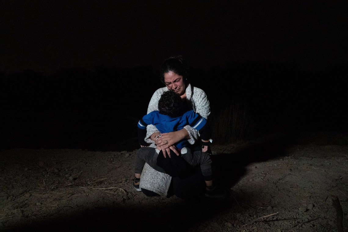 A woman and her child after crossing the Rio Grande from Mexico to the US