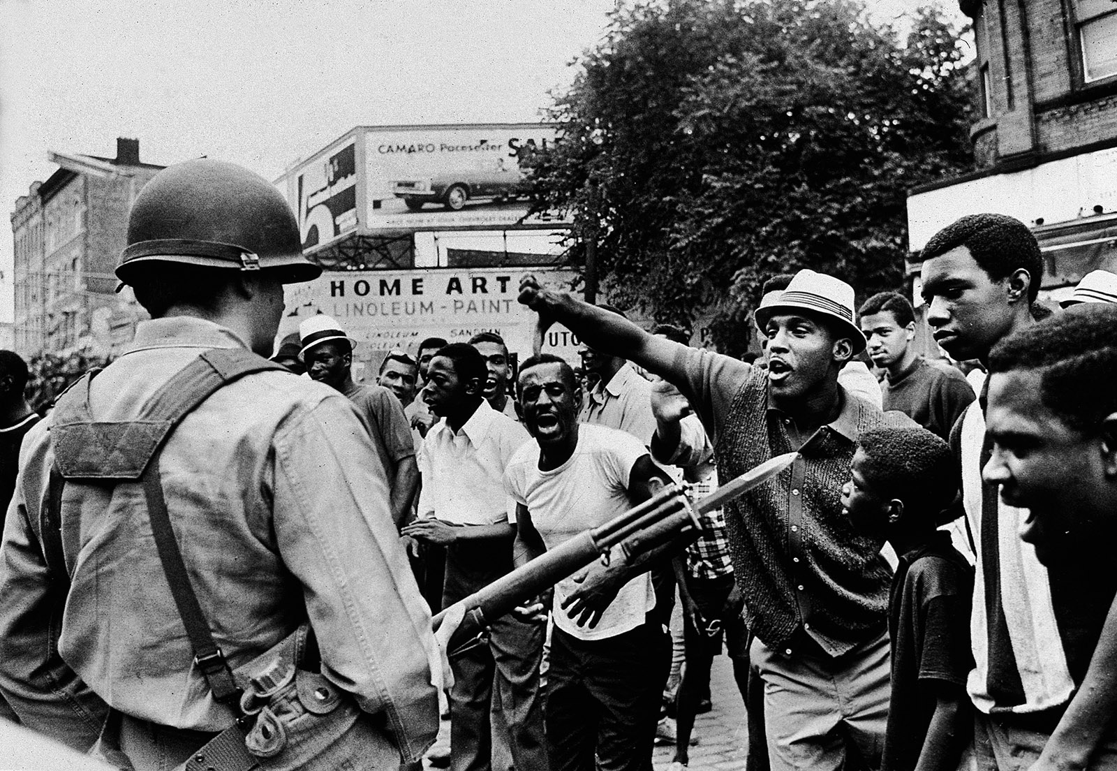 A National Guard member and protesters during the Newark race riots, July 1967