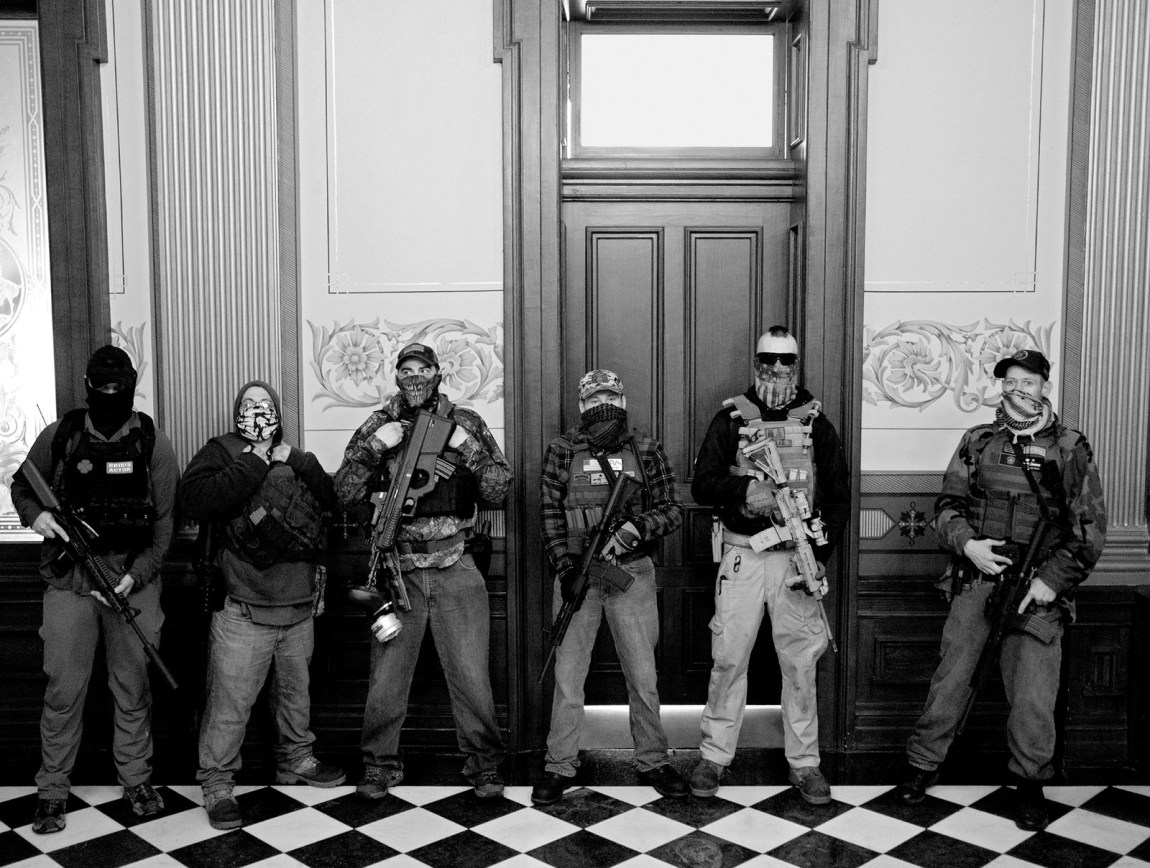 Members of a militia group outside the office of Michigan governor Gretchen Whitmer during a protest against her Covid stay-at-home order