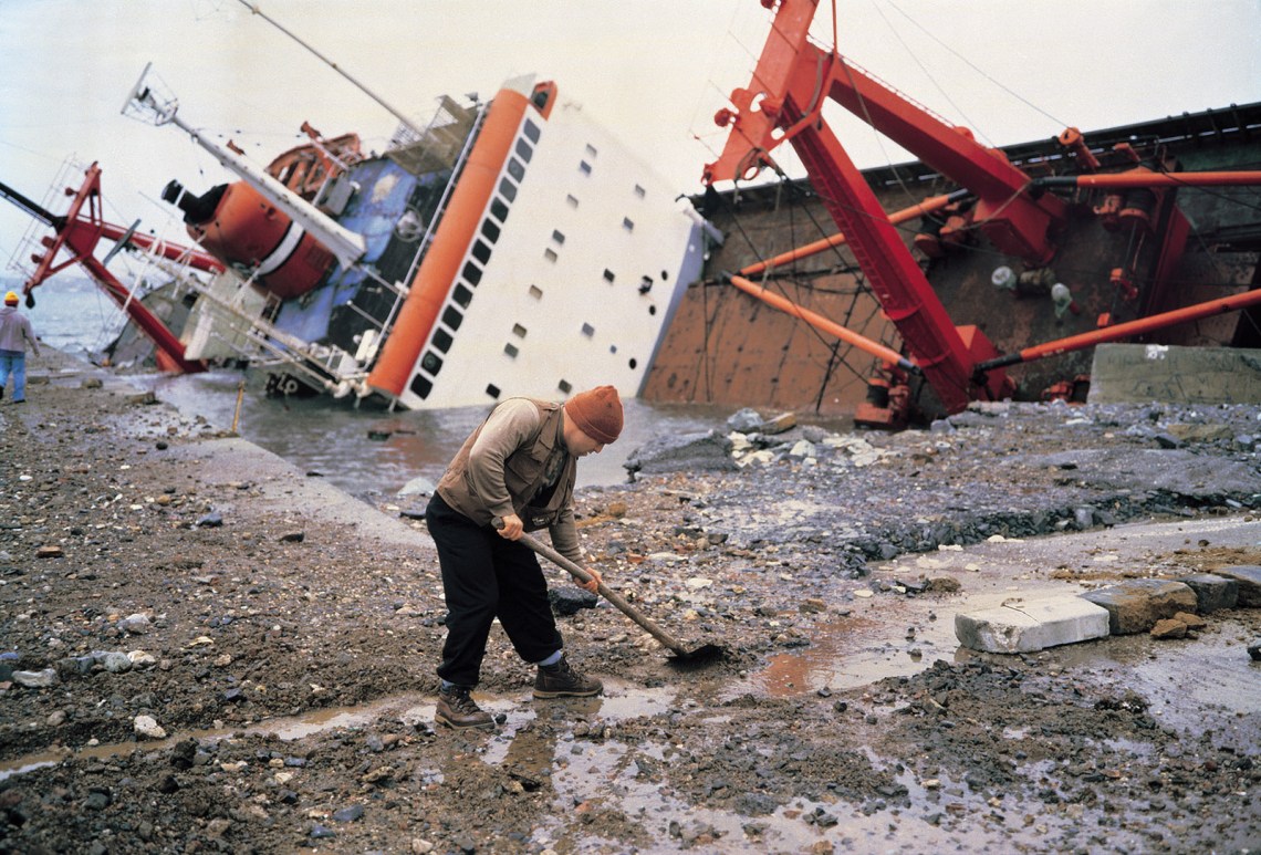 Shipwreck and worker, Istanbul; photograph by Allan Sekula