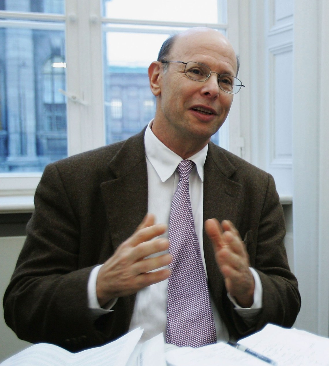 Michael Ratner after filing suit in a German court
