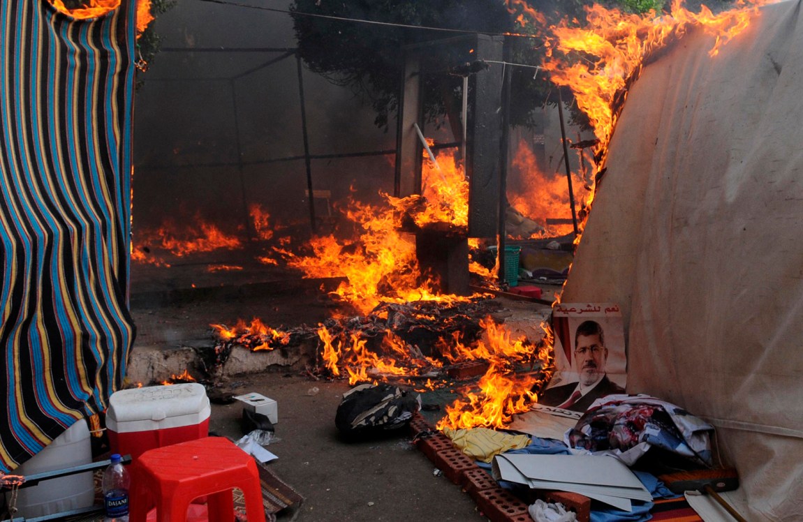 Tents burning after a protest camp of supporters of former president Mohamed Morsi was dispersed by police, Cairo