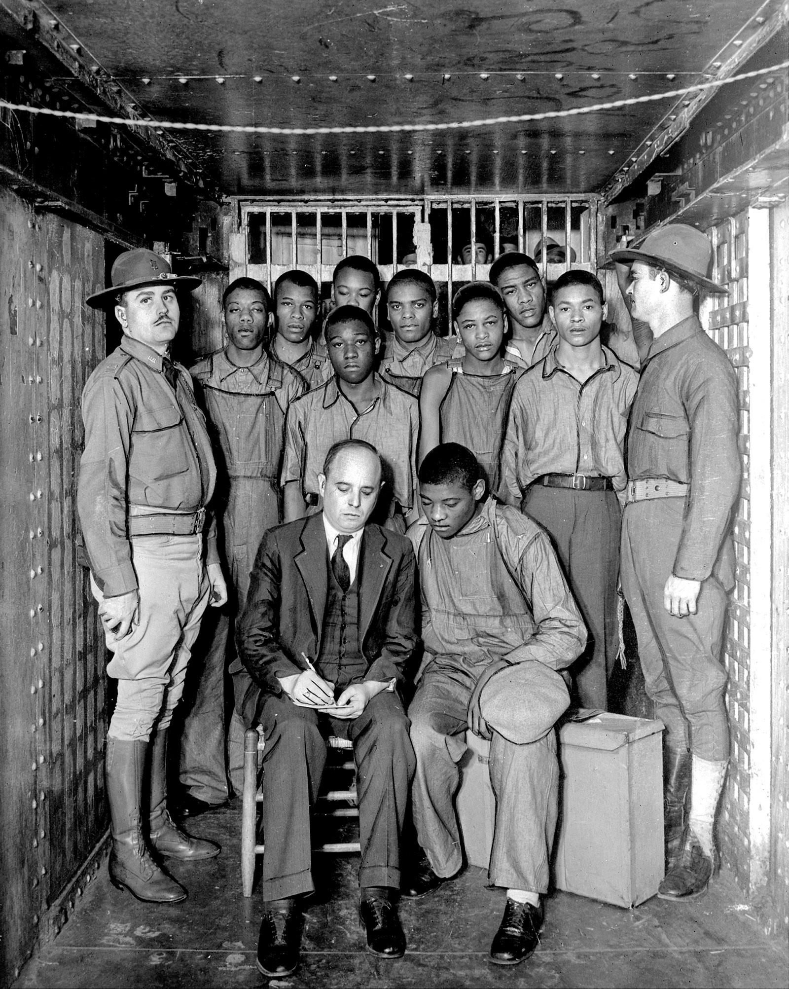 Defense attorney Samuel Leibowitz with Haywood Patterson and the other eight Scottsboro Boys, whom he represented pro bono after the US Supreme Court ruled that they had been denied the right to counsel