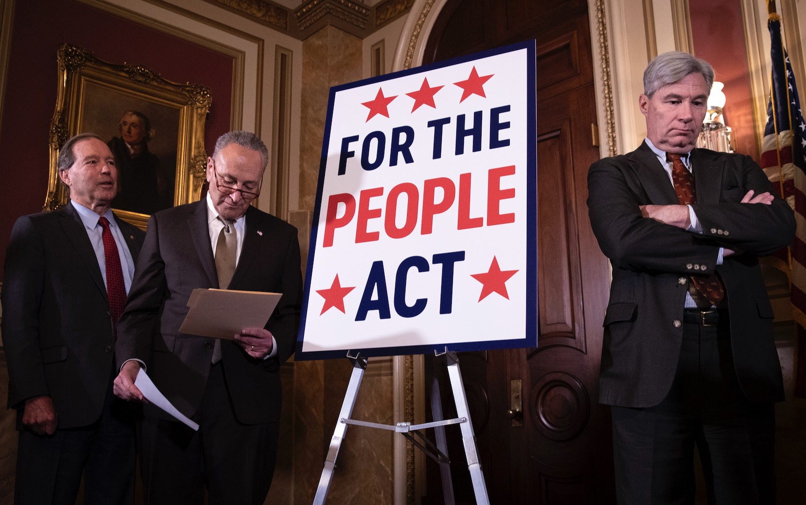 Democratic Senators Tom Udall, Chuck Schumer, and Sheldon Whitehouse in the Capitol
