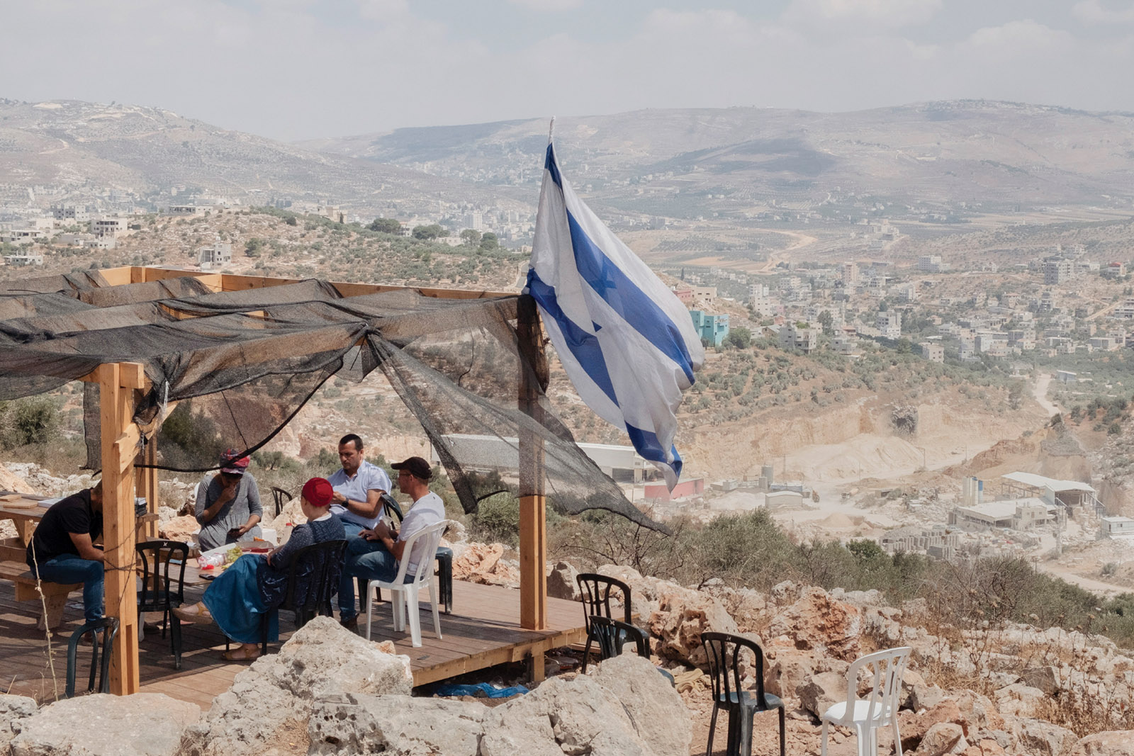 Israeli settlers in the illegal outpost of Evyatar, near the Palestinian village of Beita, West Bank