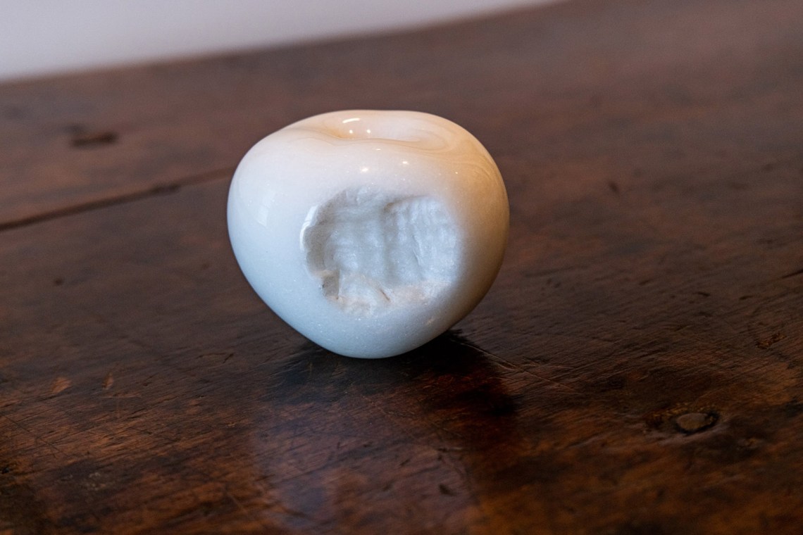 Carved marble apple with teeth marks
