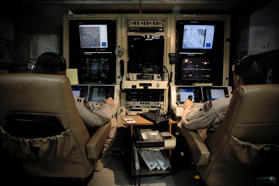 US military pilots operating Predator drones from the ground control station at Balad Air Base, Iraq