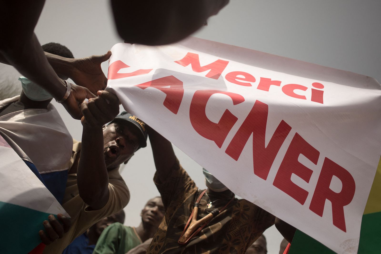 Protesters in Bamako, Mali hold a banner that reads MERCI WAGNER