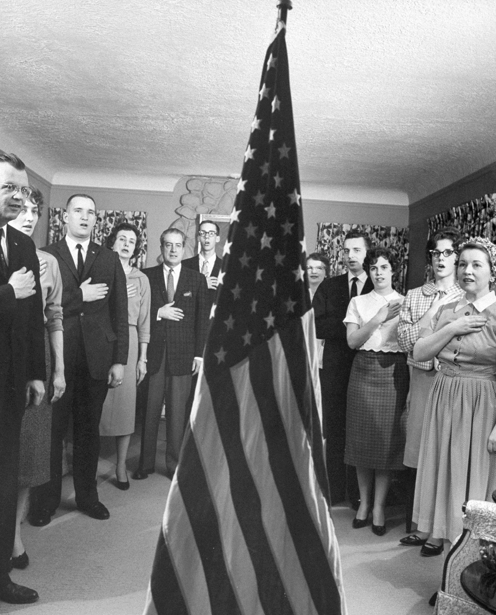 Members of the John Birch Society pledging allegiance to the flag