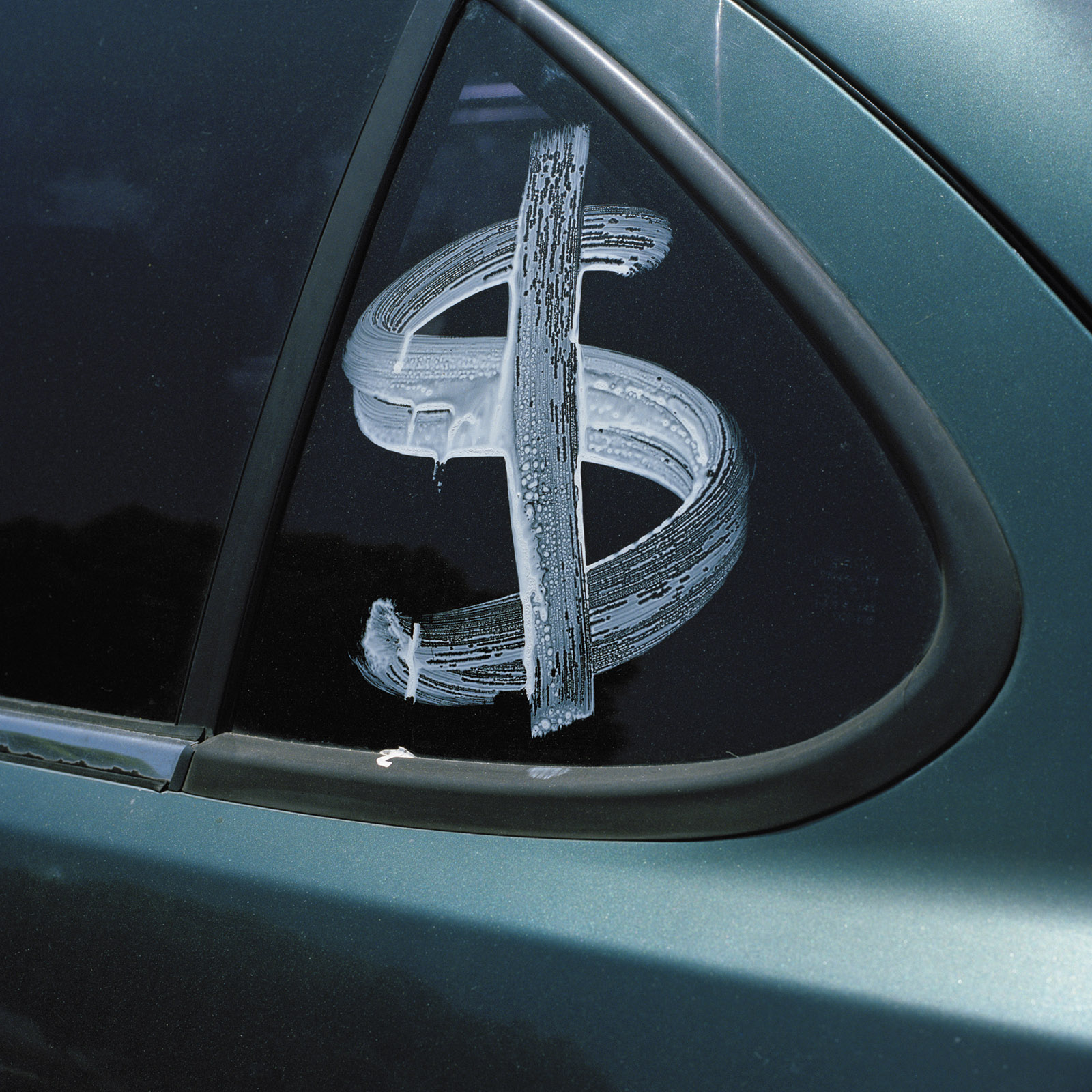 Dollar sign on a car window