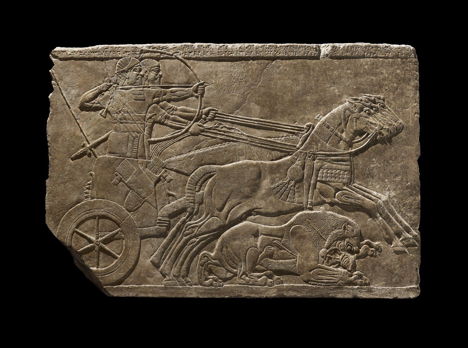 A stone relief of a royal lion hunt, Assyria, 875–860 BCE