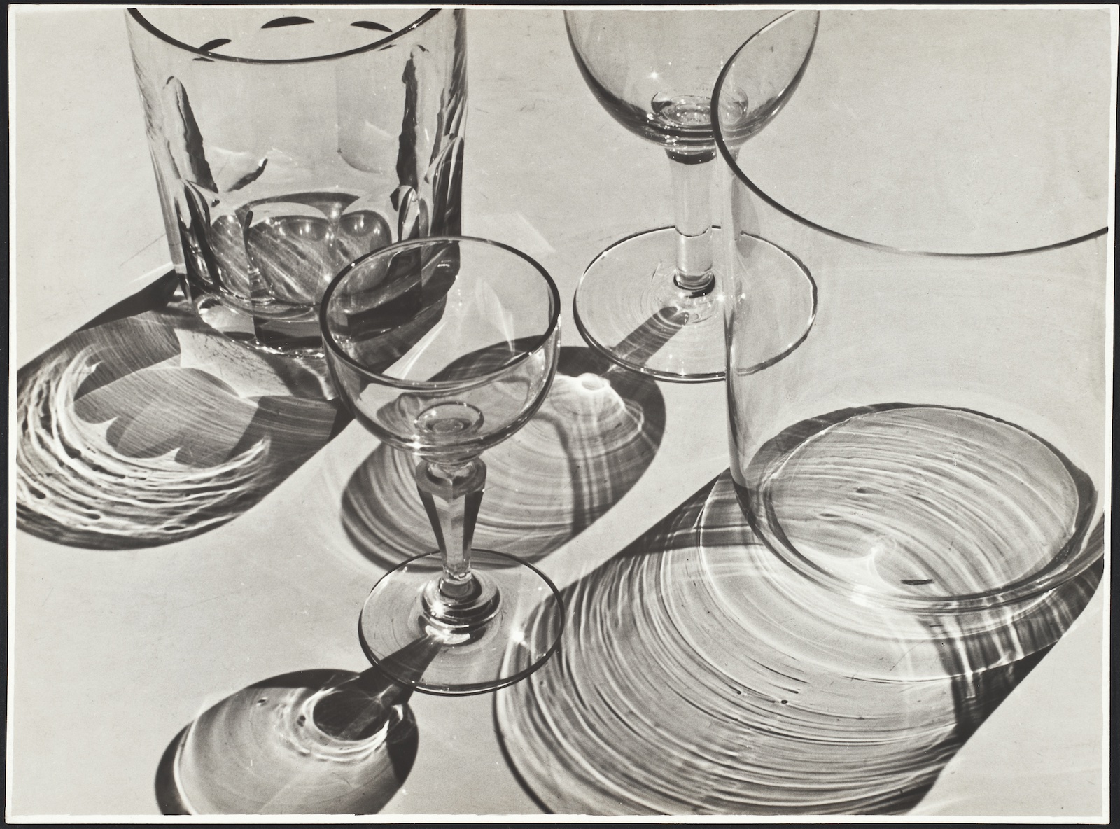 A black-and-white photograph of drinking glasses