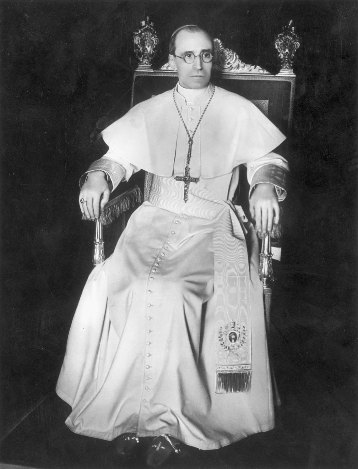 Pope Pius XII sitting in a chair