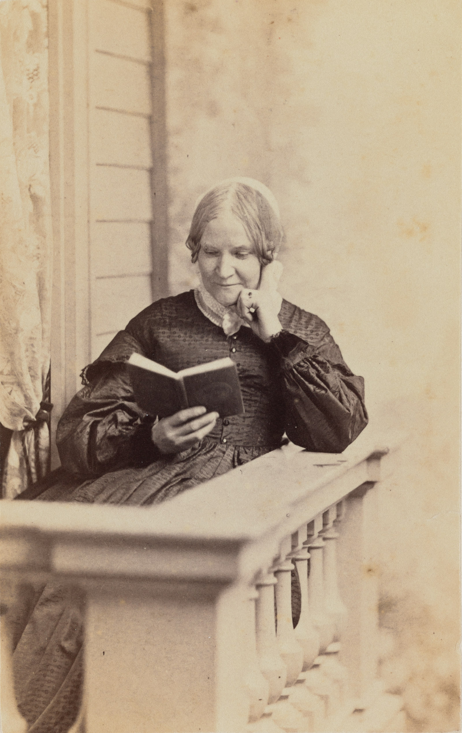 photo of Lydia Maria Child reading a book