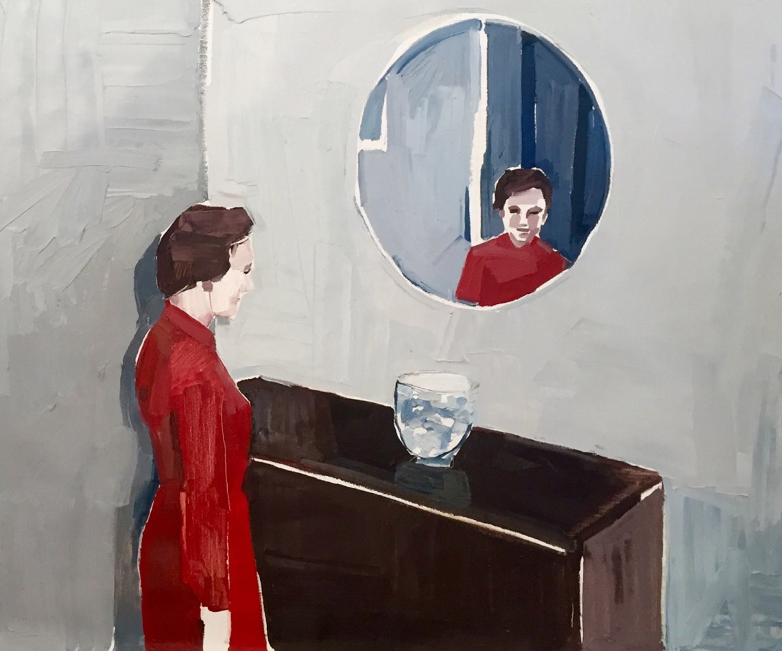 Woman standing in front of a mirror