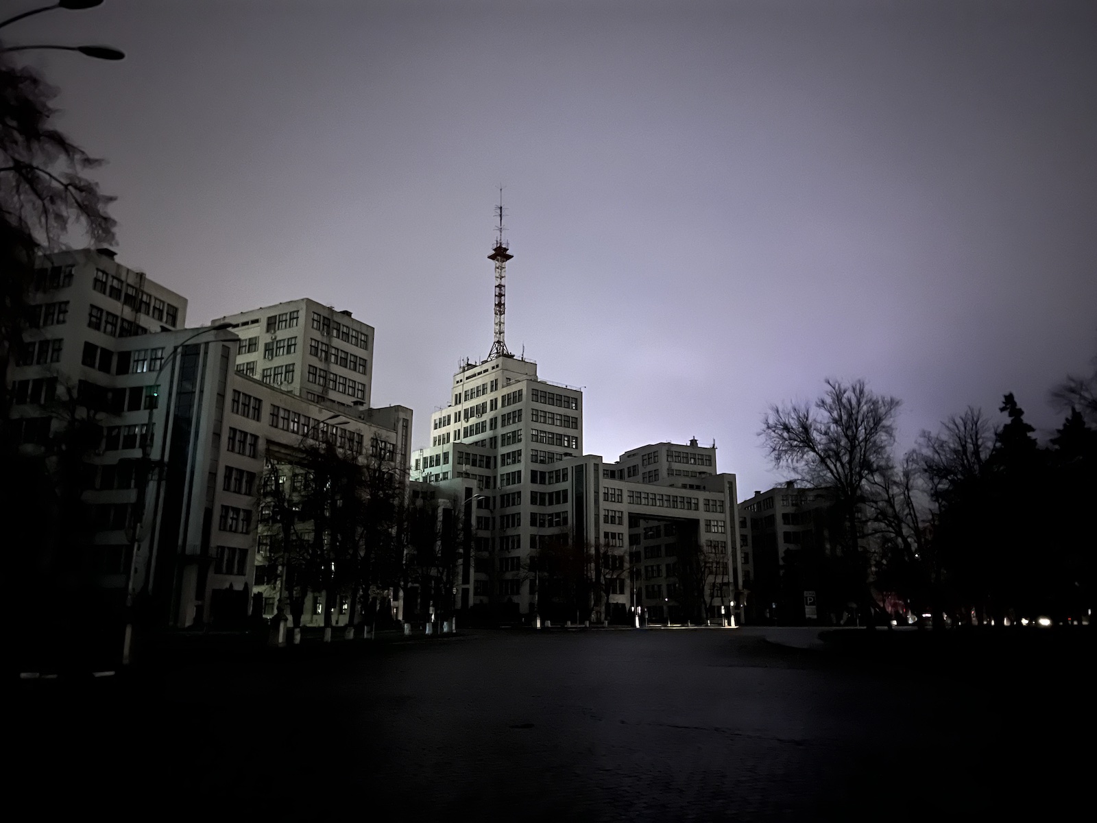Darkened buildings set off against a bright night sky