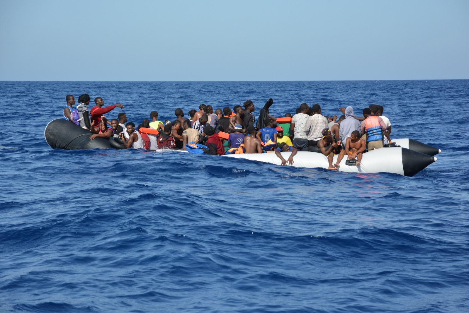 A boat filled with people at sea