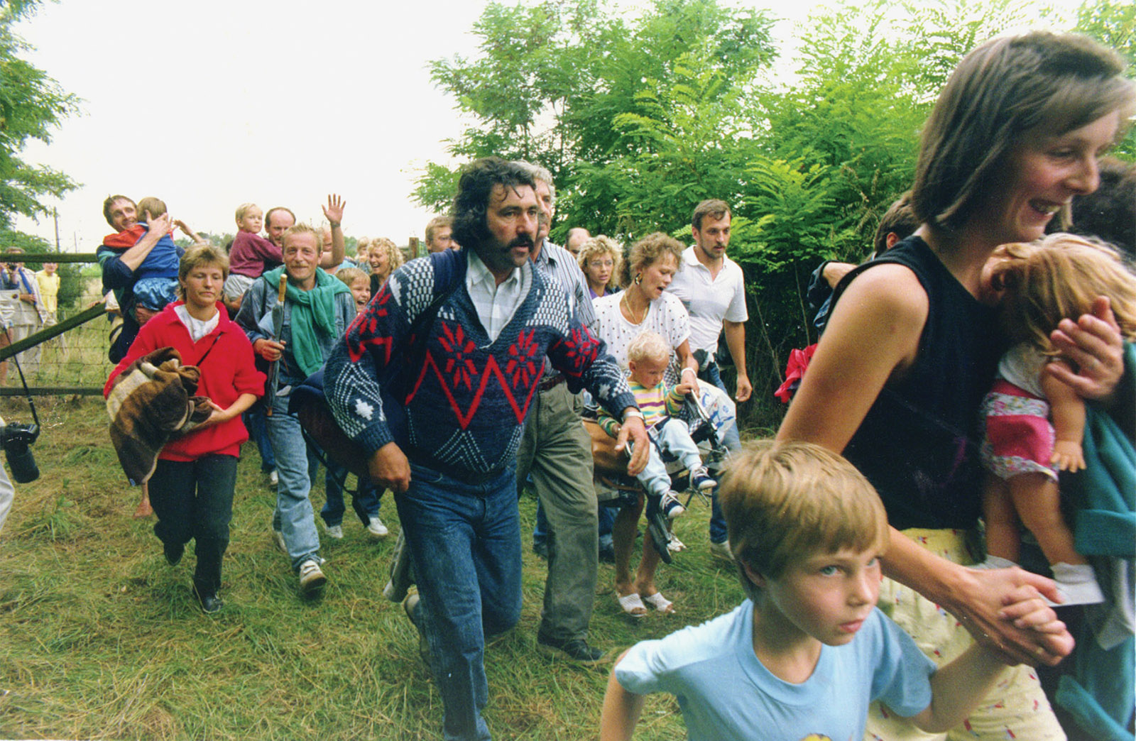 East Germans fleeing across the border from Hungary to Austria after a ‘pan-European picnic,’ Mörbisch, Austria, 1989