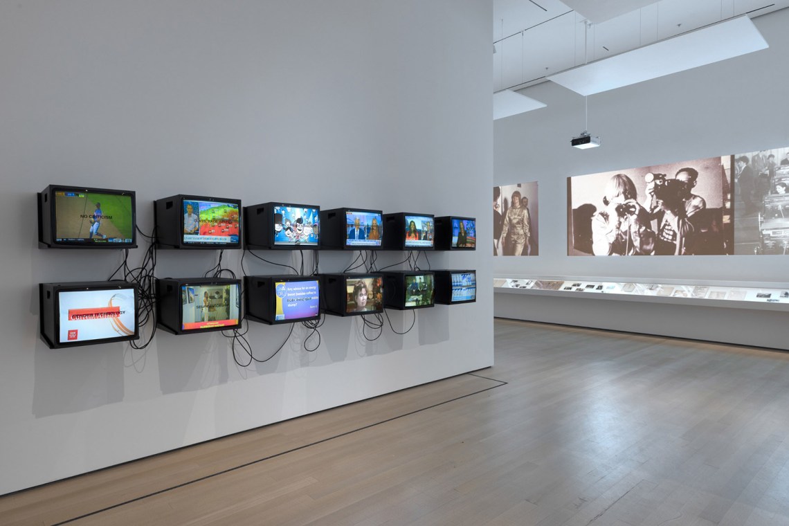 Installation view of ‘Signals: How Video Transformed the World,’ including, on the left, Gretchen Bender’s TV Text and Image, at the Museum of Modern Art,