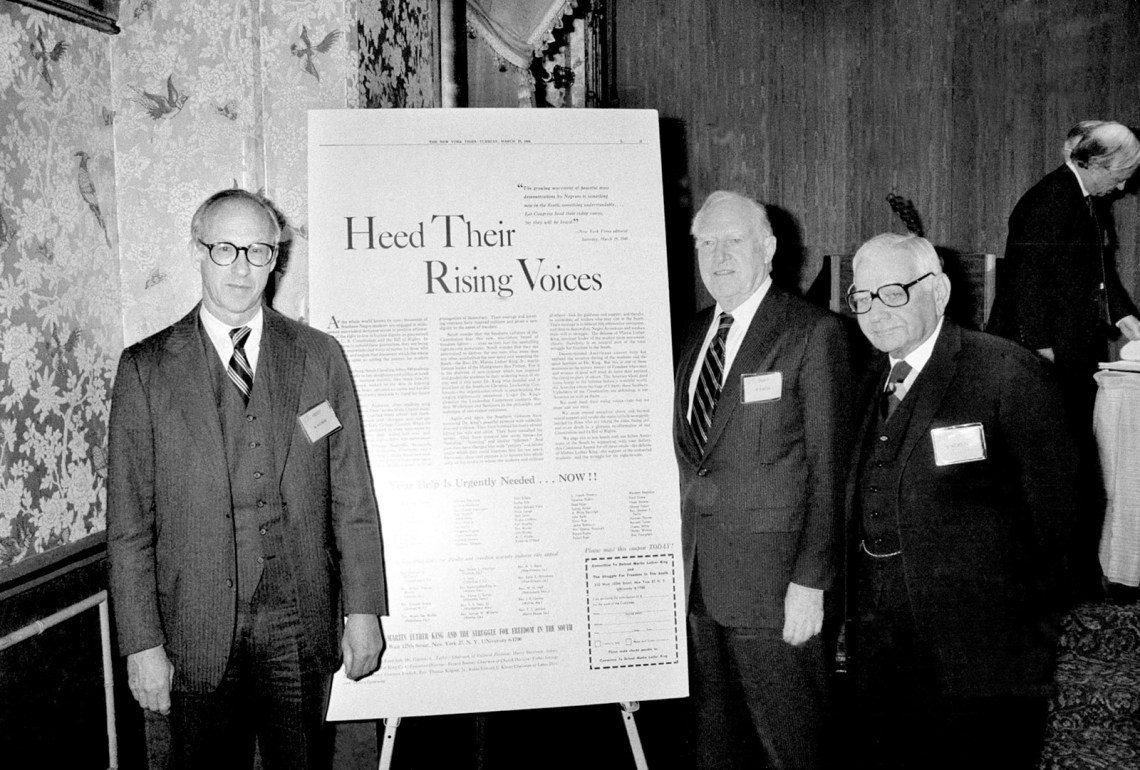 M. Roland Nachman Jr., William P. Rogers and Herbert Wechsler gathered around a ­reproduction of the advertisement that prompted L.B. Sullivan to sue The New York Times