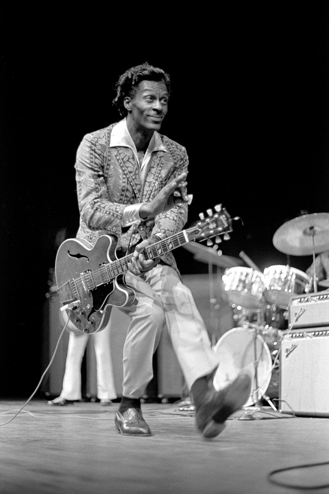 Chuck Berry duckwalking during a performance at the Berkeley Community Theater