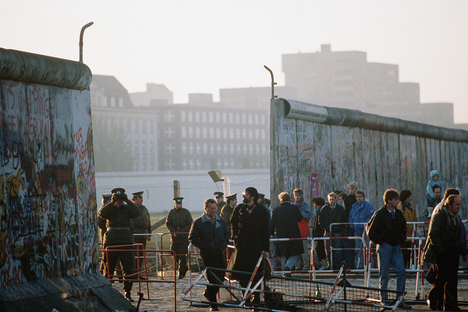 Visitors passing through the new opening in the Berlin Wall at Potsdamer Platz, November 1989