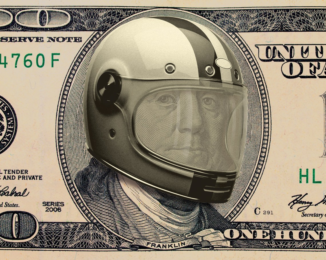 Benjamin Franklin wearing a motorcycle helmet on the front of a one hundred dollar bill